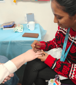 Phot of staff doing Henna 